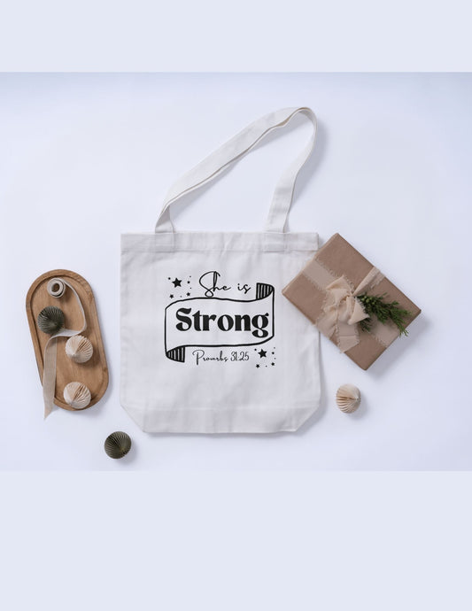 "She Is Strong" Proverbs 31:25 Tote Bag – Faith & Strength in Every Carry